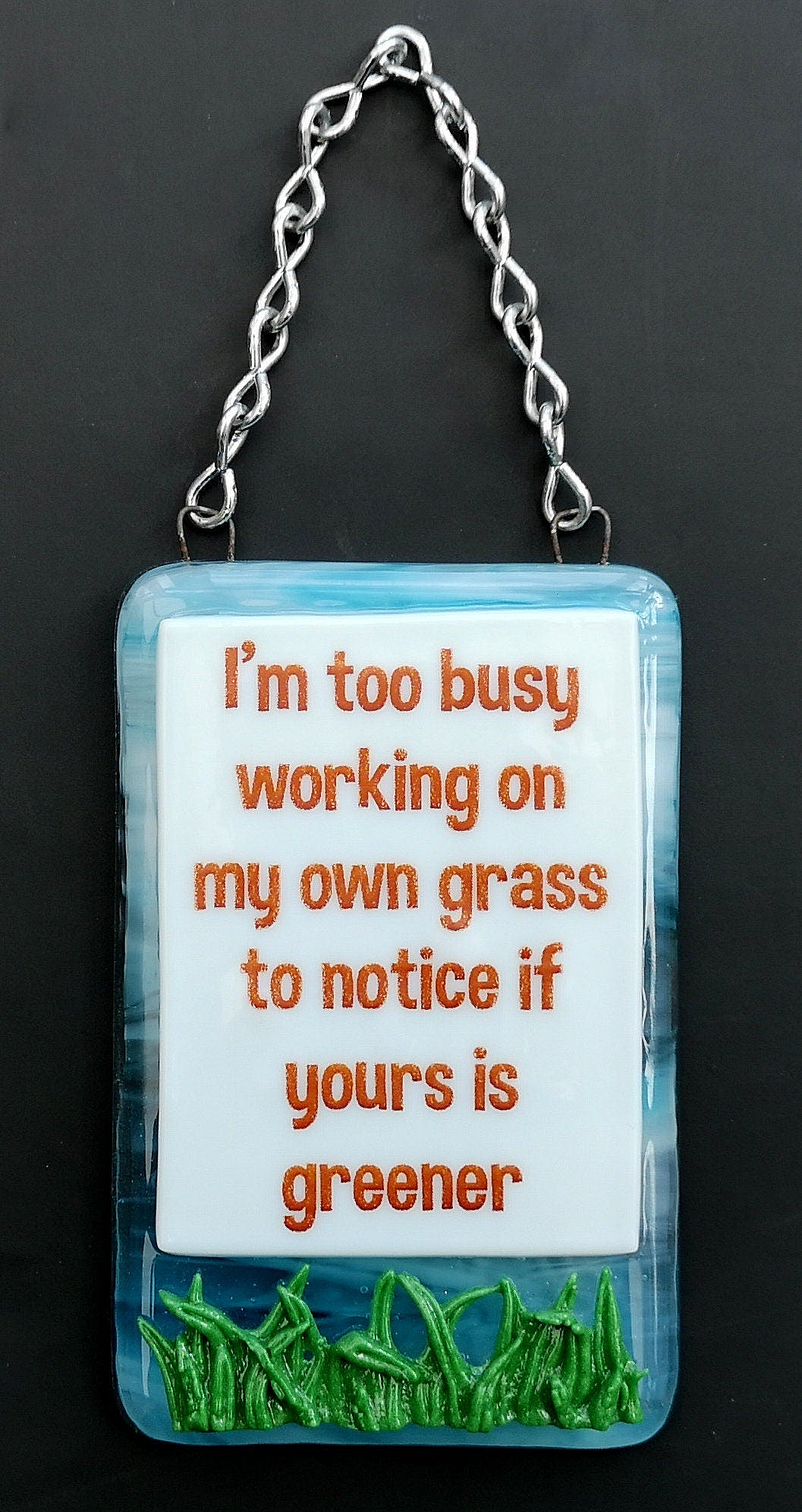 Handmade fused glass Busy Working On Own Grass To Notice If Yours Is Greener hanging picture suncatcher. Inspirational gift, funny card, humorous quote plaque, positive message sign.