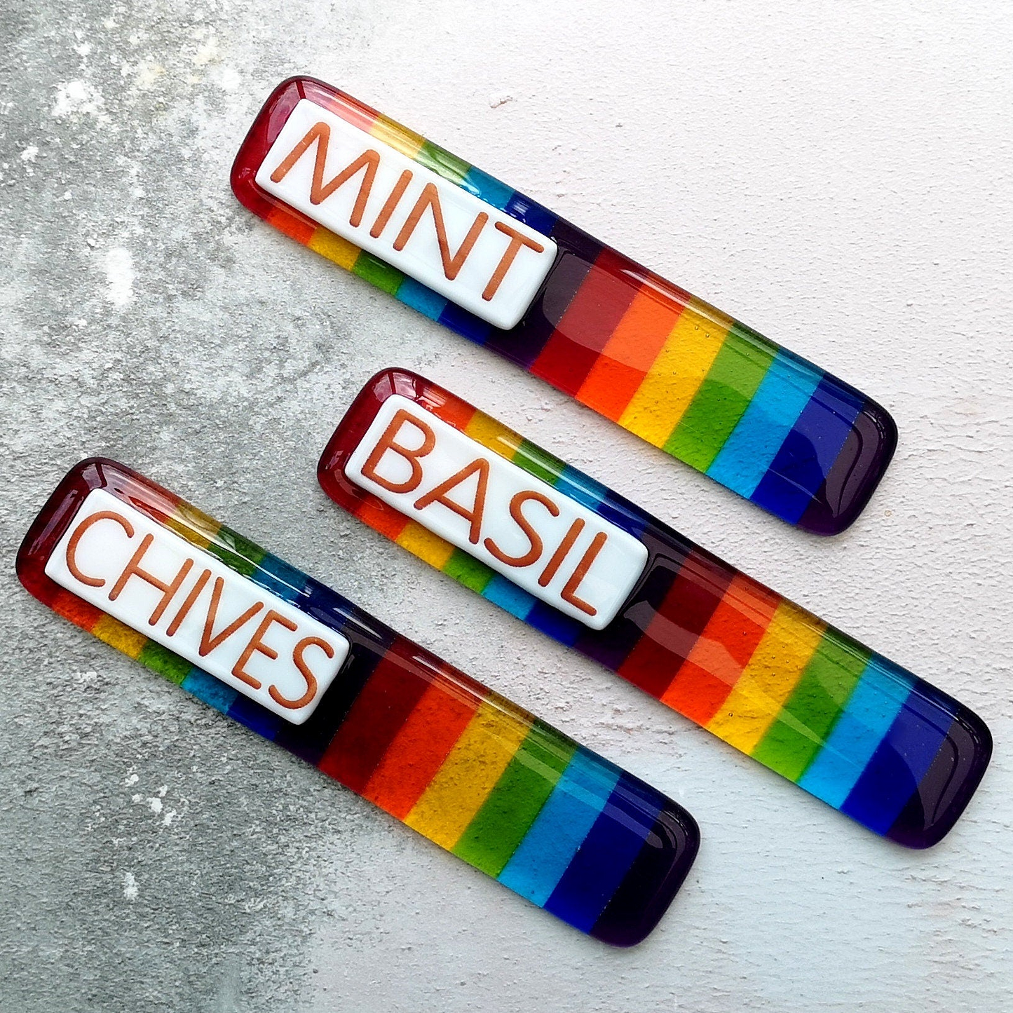 Handmade fused glass personalised rainbow plant label. Colourful plant marker. Rainbow striped garden plant stake. Herb, vegetable, flower, fruit name.