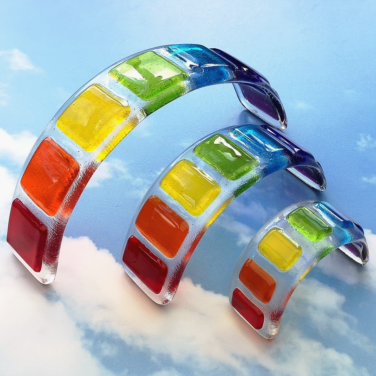 Handmade fused glass curved rainbow bridge. 3D pet paw prints. Free standing rainbow arch, rainbow steps. Brightly coloured glass gift. Suncatcher, light catcher. Gift for pet loss, remembrance.