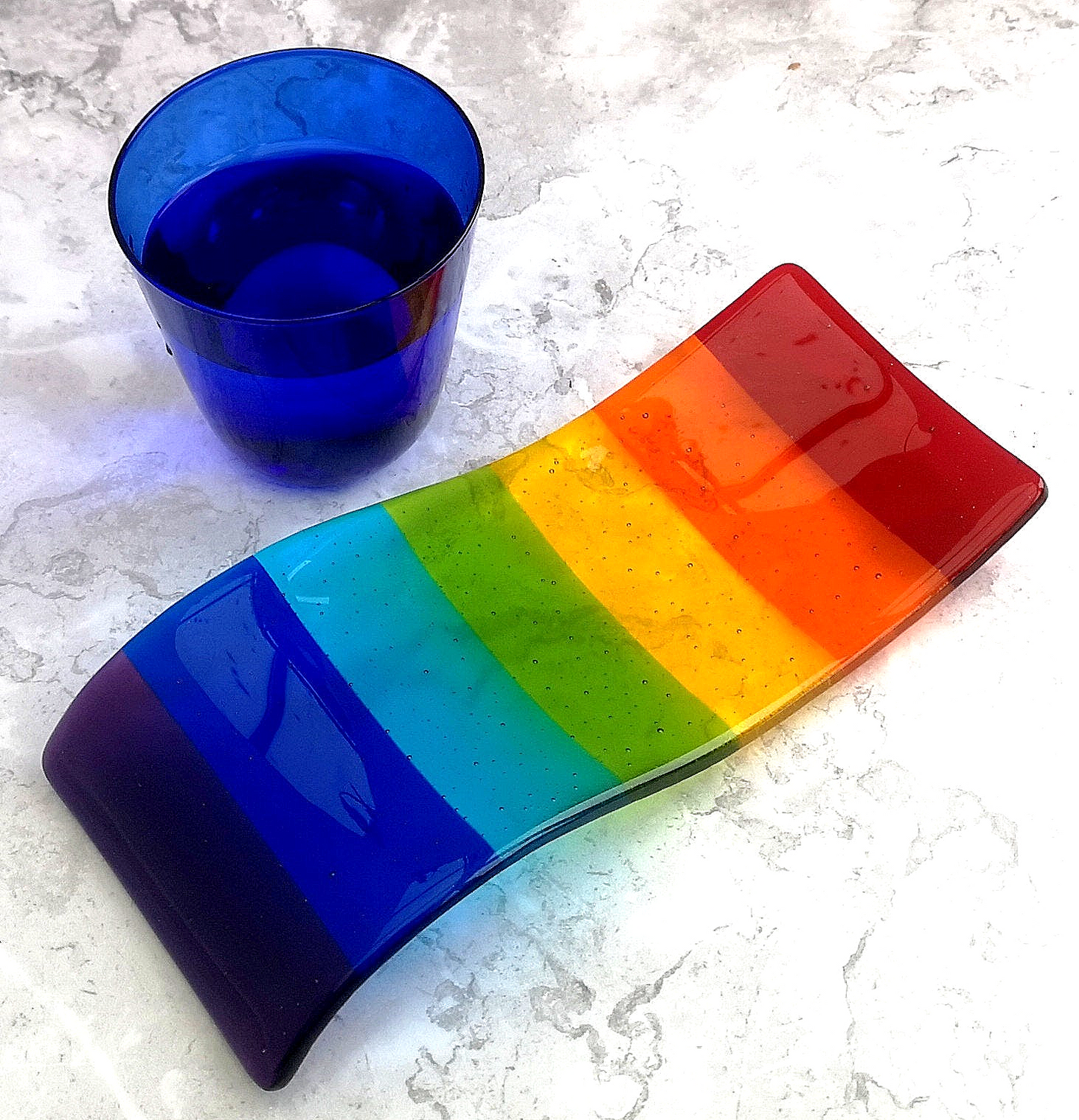 Handmade fused glass free standing Rainbow Curved Picture Suncatcher or Spoon Rest. Brightly coloured wavy light catcher, rainbow decor.