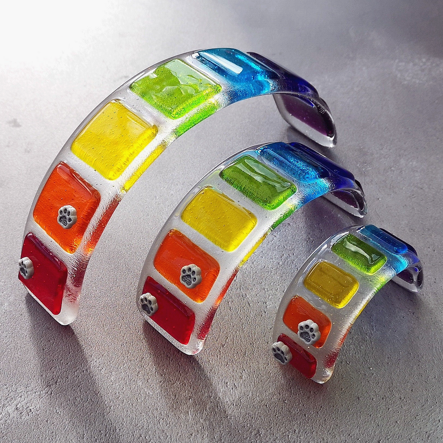 Handmade fused glass curved rainbow bridge. 3D pet paw prints. Free standing rainbow arch, rainbow steps. Brightly coloured glass gift. Suncatcher, light catcher. Gift for pet loss, remembrance.