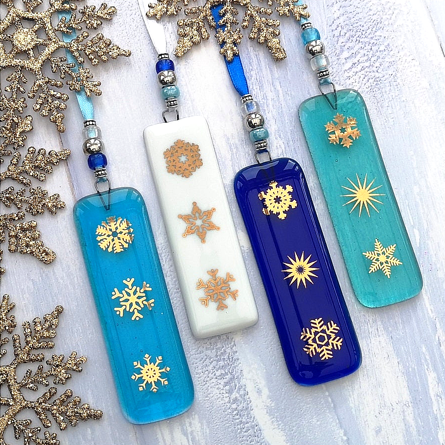 a group of four different colored snowflakes on a table