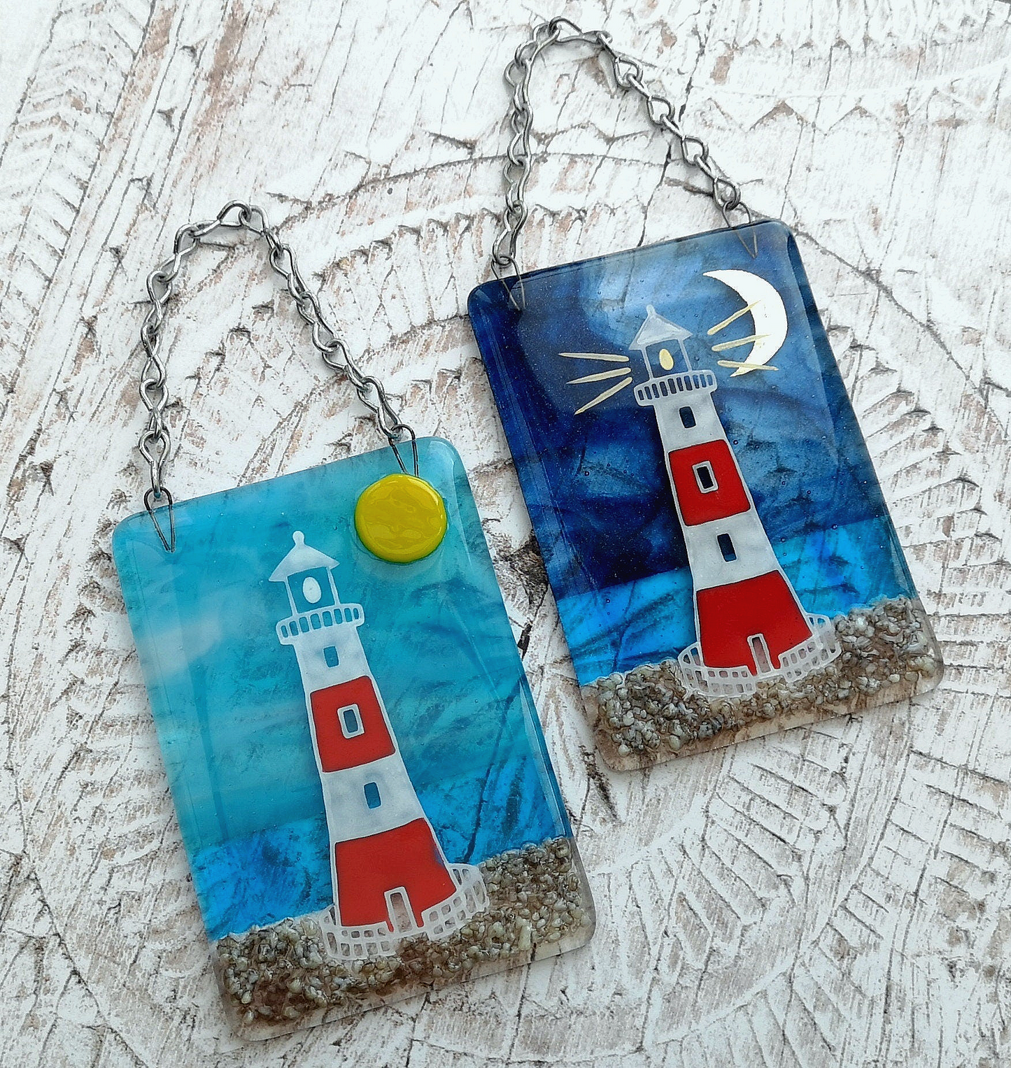 Handmade fused glass 3D Lighthouse Hanging Picture. Seaside suncatcher wall art, beach gift decoration, sea ocean scene with glass pebbles, red & white light house, sun and blue sky or silver moon and night sky.