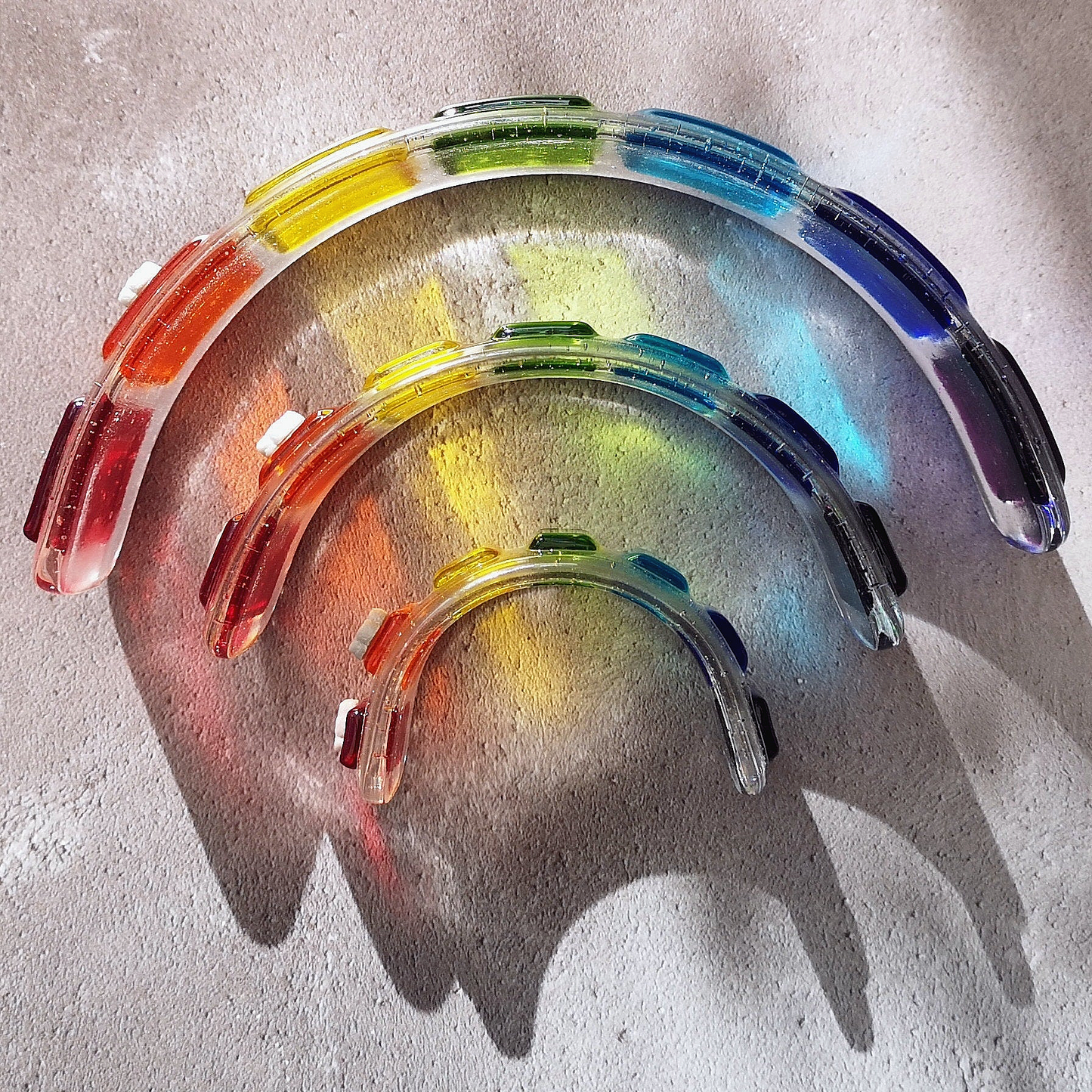Handmade fused glass curved rainbow bridge. 3D pet paw prints. Free standing rainbow arch, rainbow steps. Brightly coloured glass gift. Suncatcher, light catcher. Gift for pet loss, remembrance.