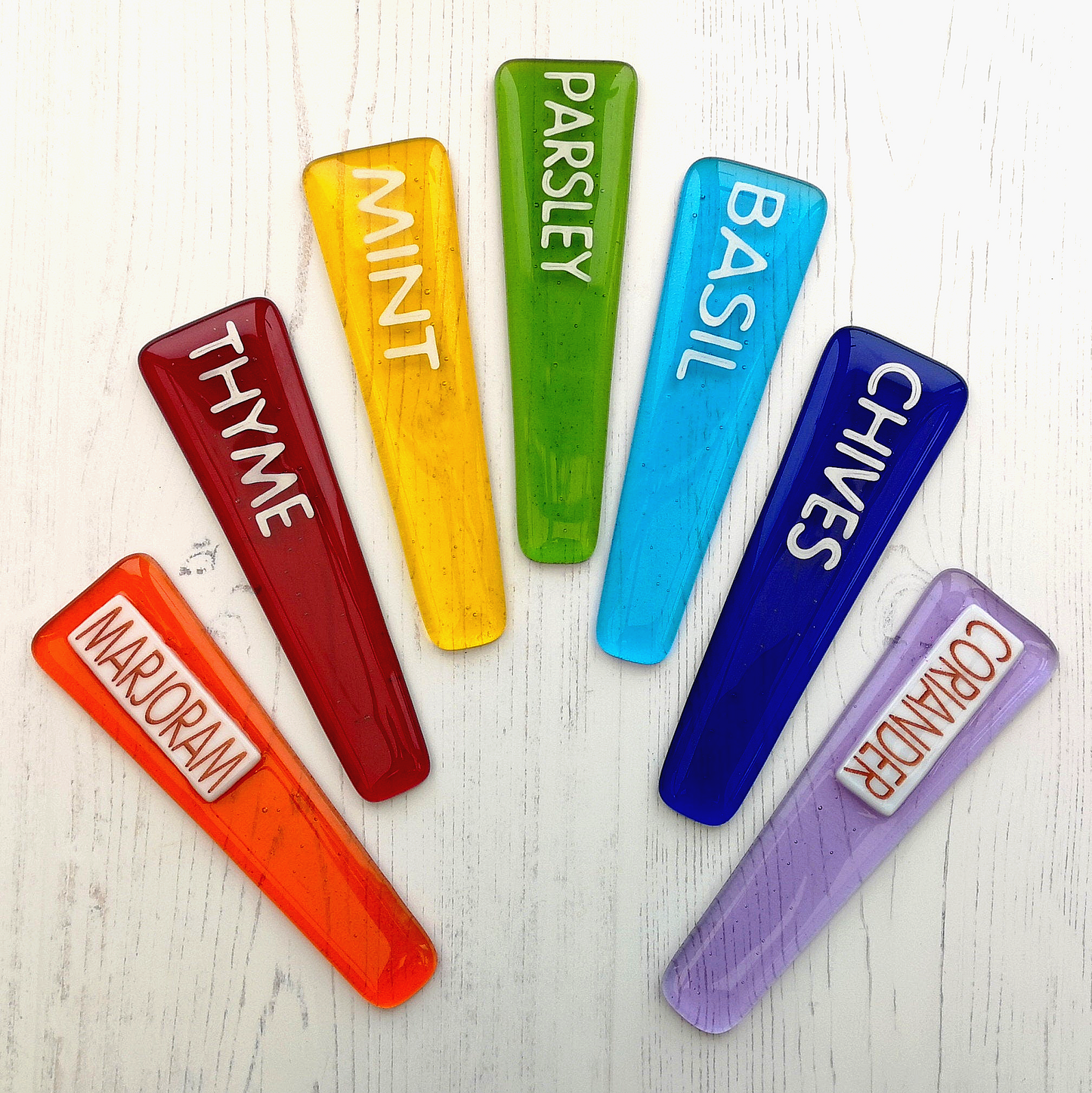 Handmade colourful fused glass plant labels that won't fade or rot with sunlight or moisture. Personalised plant markers for pot plants. Garden lover gift.