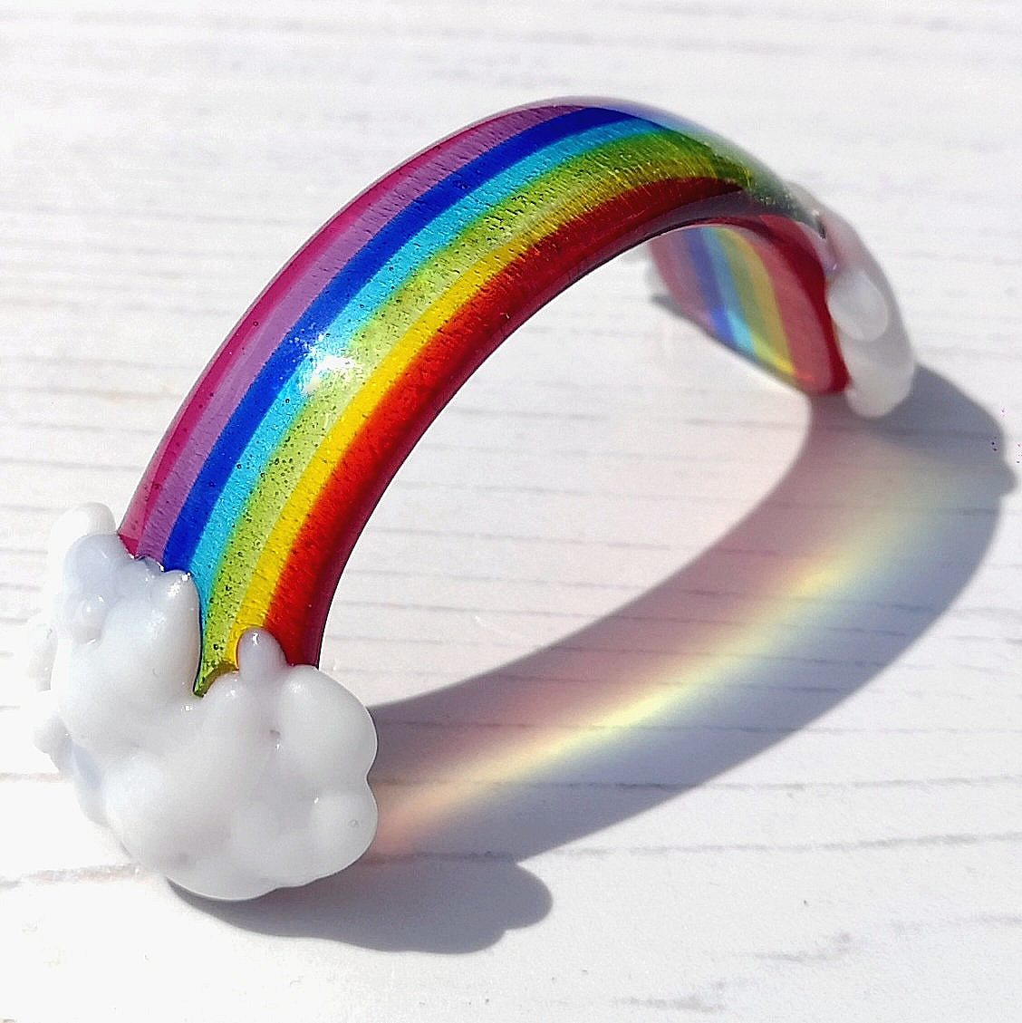 Handmade fused glass curved rainbow bridge with clouds. Free standing personalised 3D name rainbow arch. Brightly coloured glass gift. Suncatcher, light catcher. Gift for pet loss, remembrance.