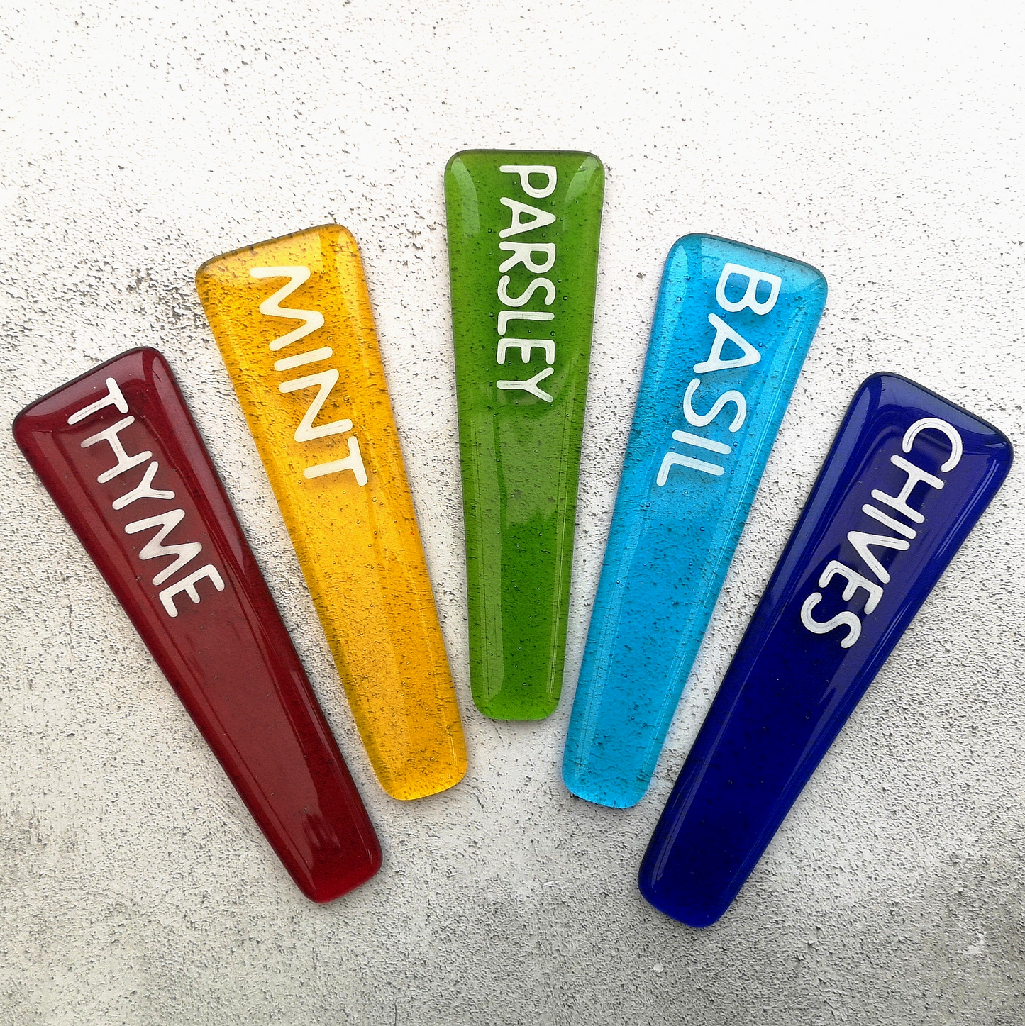 Handmade colourful fused glass plant labels that won't fade or rot with sunlight or moisture. Personalised plant markers for pot plants. Garden lover gift.