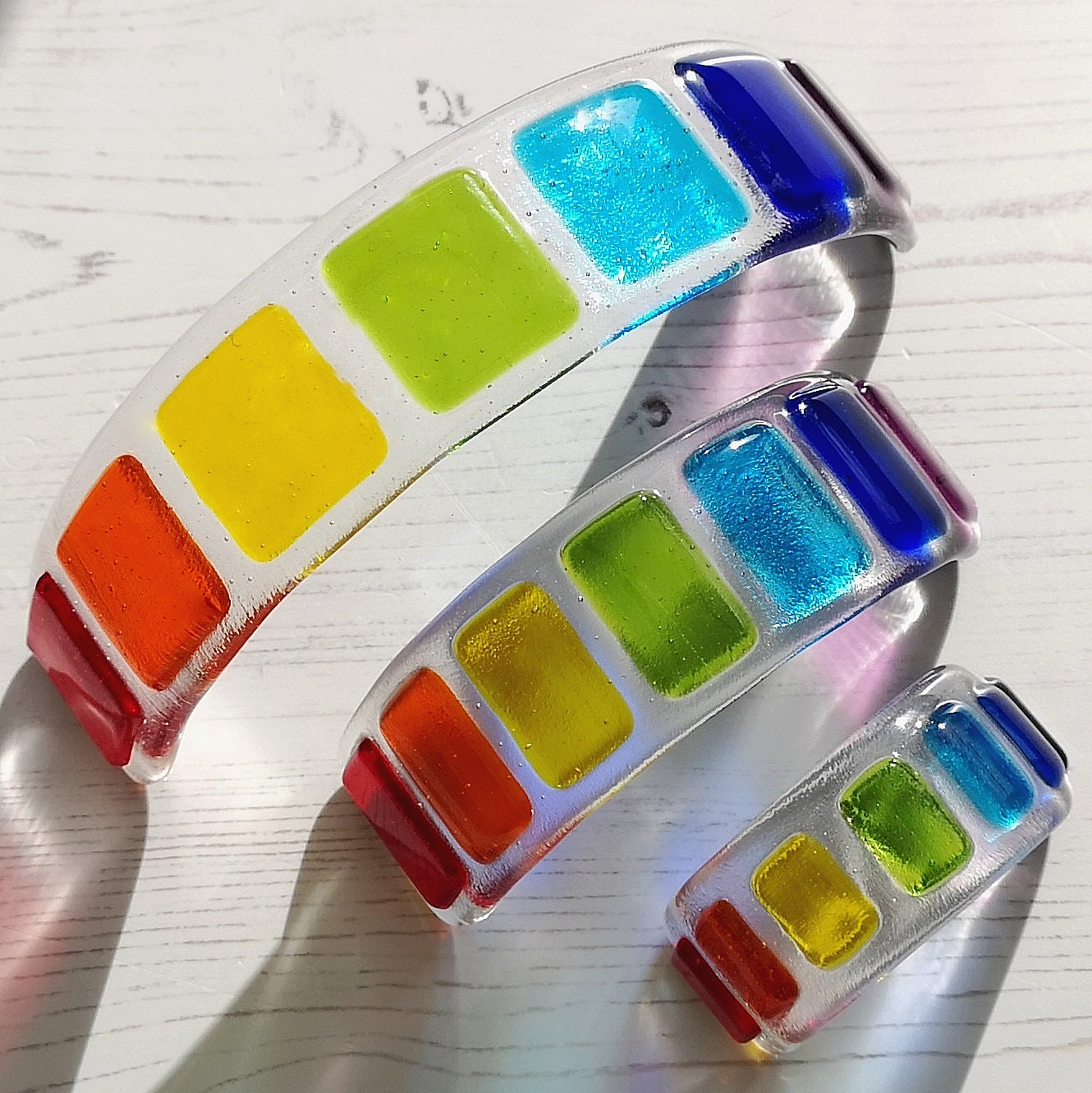 Handmade fused glass curved rainbow bridge. 3D pet paw prints. Free standing rainbow arch, rainbow steps. Brightly coloured glass gift. Suncatcher, light catcher. Gift for pet loss, remembrance.
