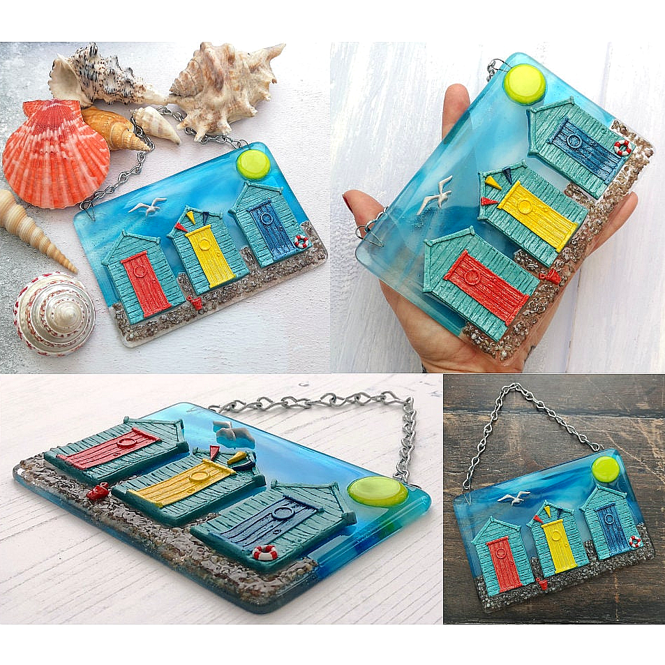 Handmade fused glass 3D Beach Huts Hanging Picture. Seaside suncatcher wall art, beach gift decoration, sea ocean scene with glass pebbles, seagull, bucket and spade, bunting & blue sky.