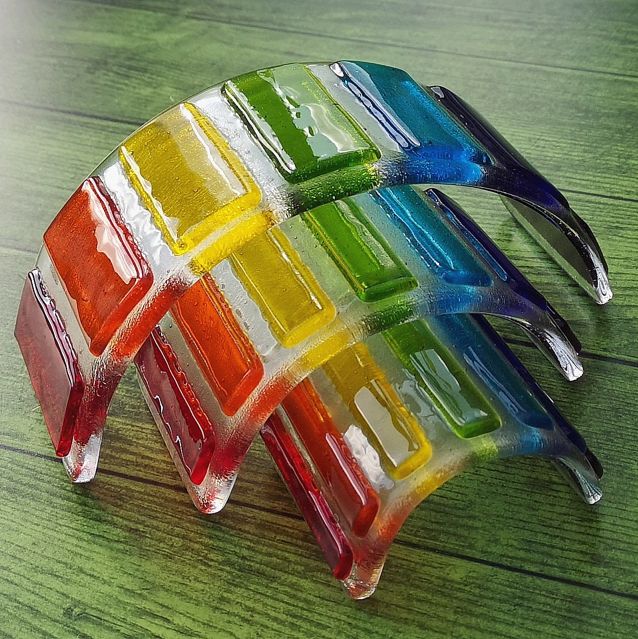 Handmade fused glass curved rainbow bridge. 3D pet paw prints. Free standing personalised 3D name rainbow arch. Brightly coloured glass gift. Suncatcher, light catcher. Gift for pet loss, remembrance.