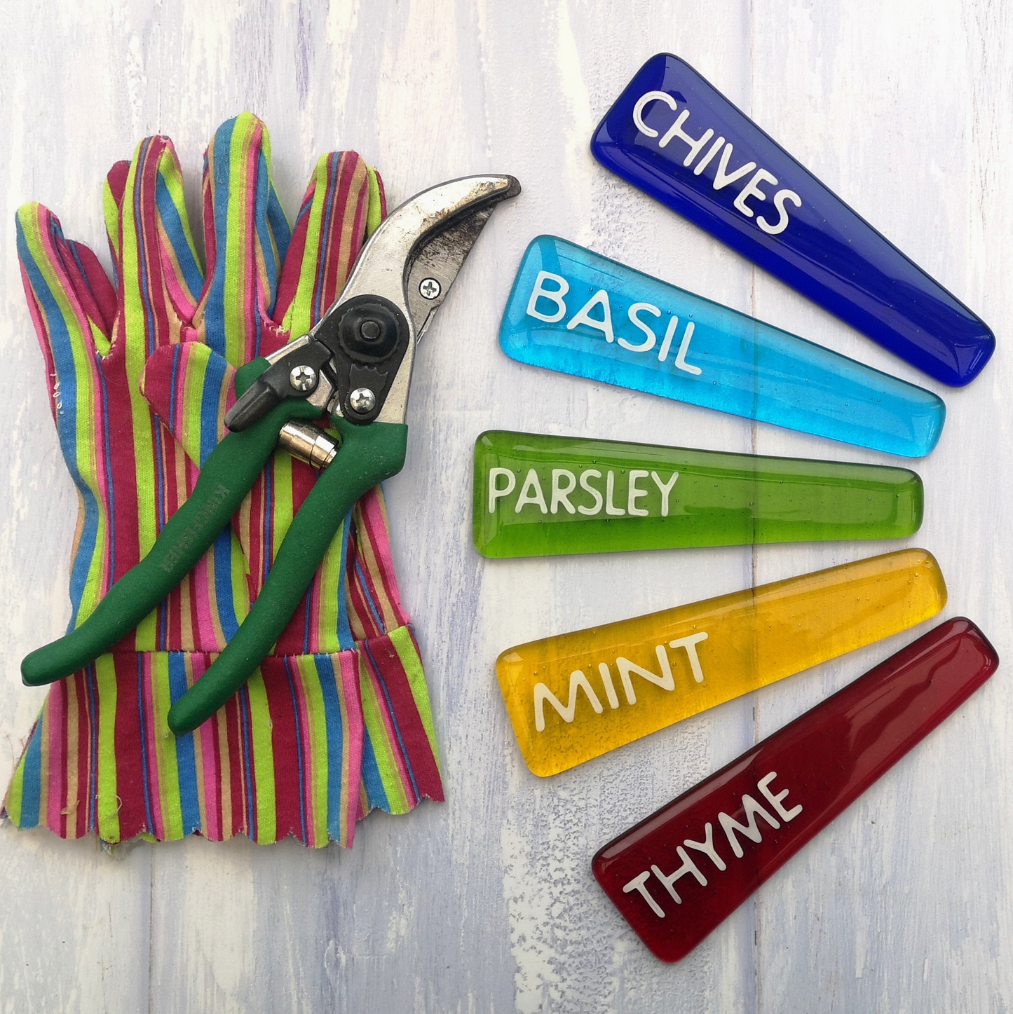 Handmade colourful fused glass plant labels that won't fade or rot with sunlight or moisture. Personalised plant markers for pot plants. Garden lover gift.
