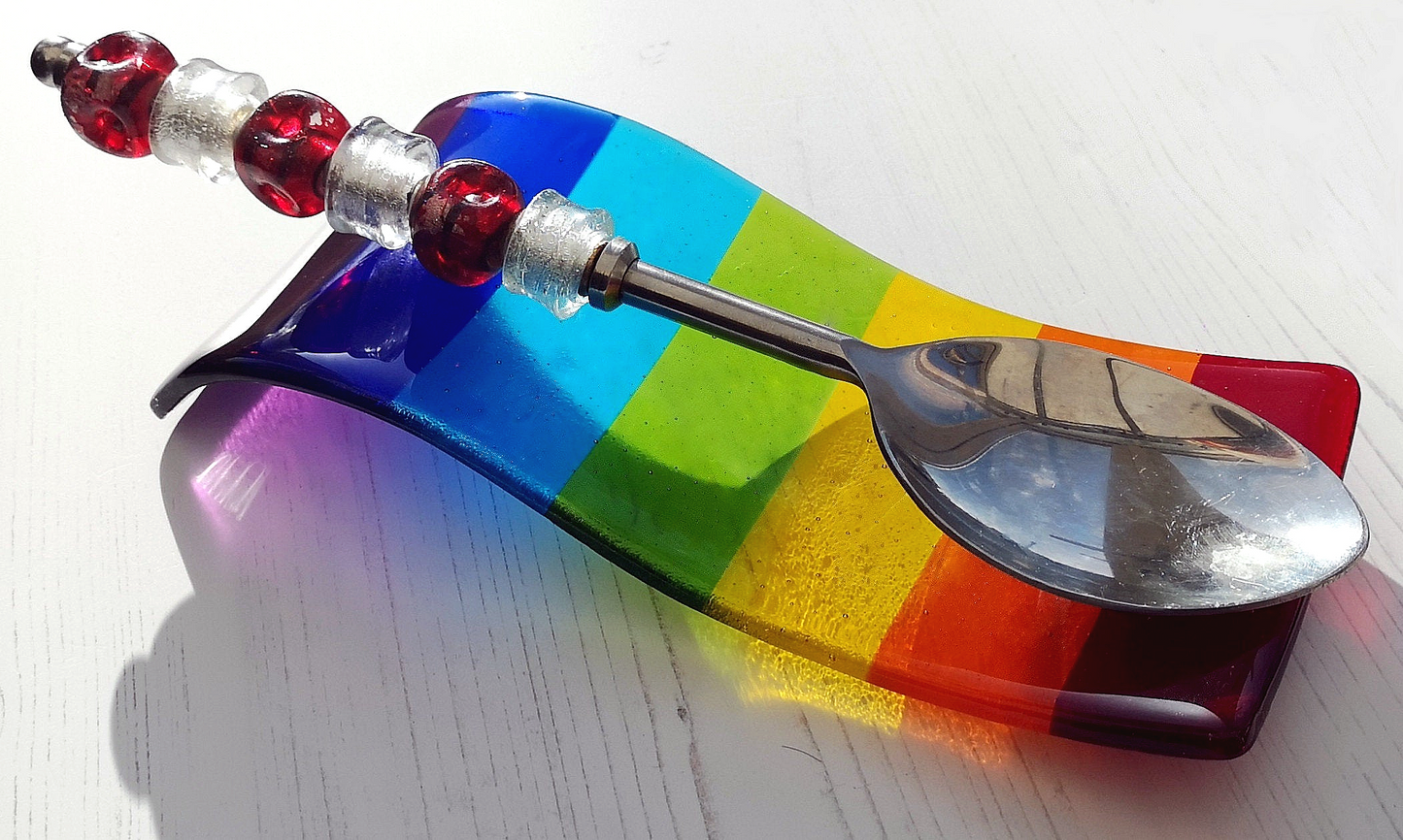 Handmade fused glass free standing Rainbow Curved Picture Suncatcher or Spoon Rest. Brightly coloured wavy light catcher, rainbow decor.