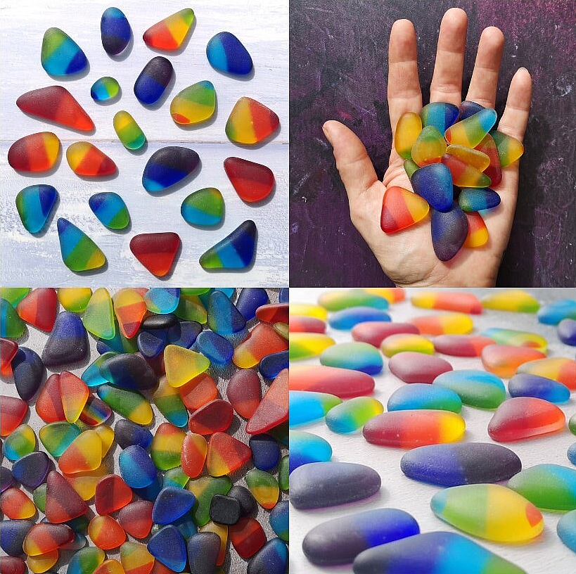 A vibrant array of multicolored tumbled glass pieces, spread out to showcase their mixed sizes and frosted, weathered sea glass appearance, ideal for crafting