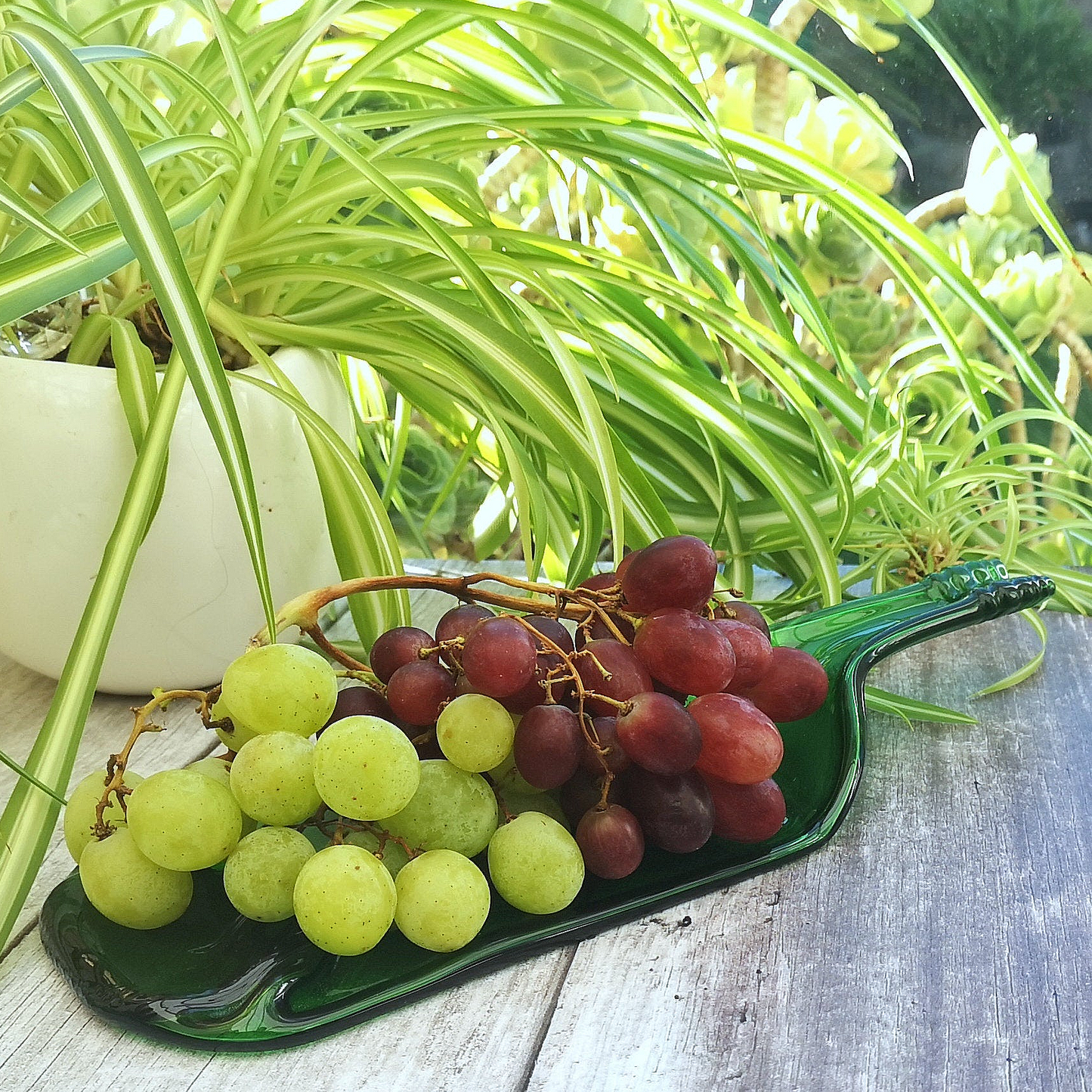 Handmade fused glass Recycled Wine Bottle Plate or Spatula With Raised Neck Handle. Squashed, slumped bottle serving dish. Eco gift, zero waste, reclaimed, upcycled glass platter.