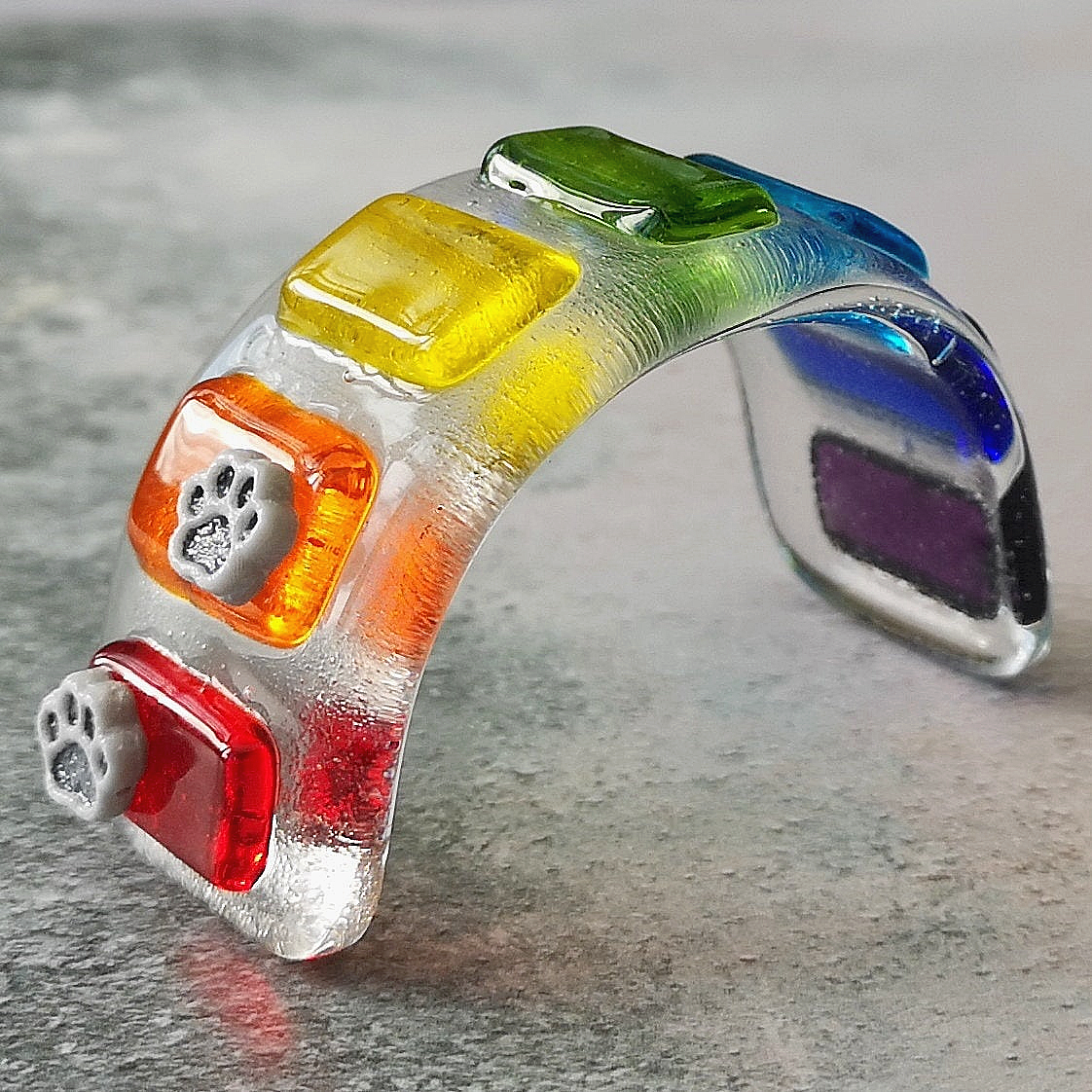 Handmade fused glass curved rainbow bridge. 3D pet paw prints. Free standing rainbow arch, rainbow steps. Brightly coloured glass gift. Suncatcher, light catcher. Gift for pet loss, remembrance.