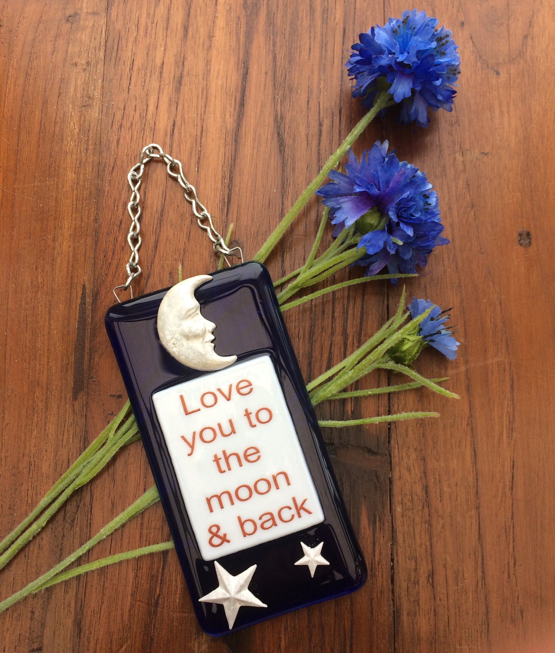 Handmade fused glass Love You To The Moon And Back Hanging Decoration. Valentine suncatcher gift. Moon and stars, romantic, love, message from the heart present. Girlfriend, boyfriend, partner, husband, wife.
