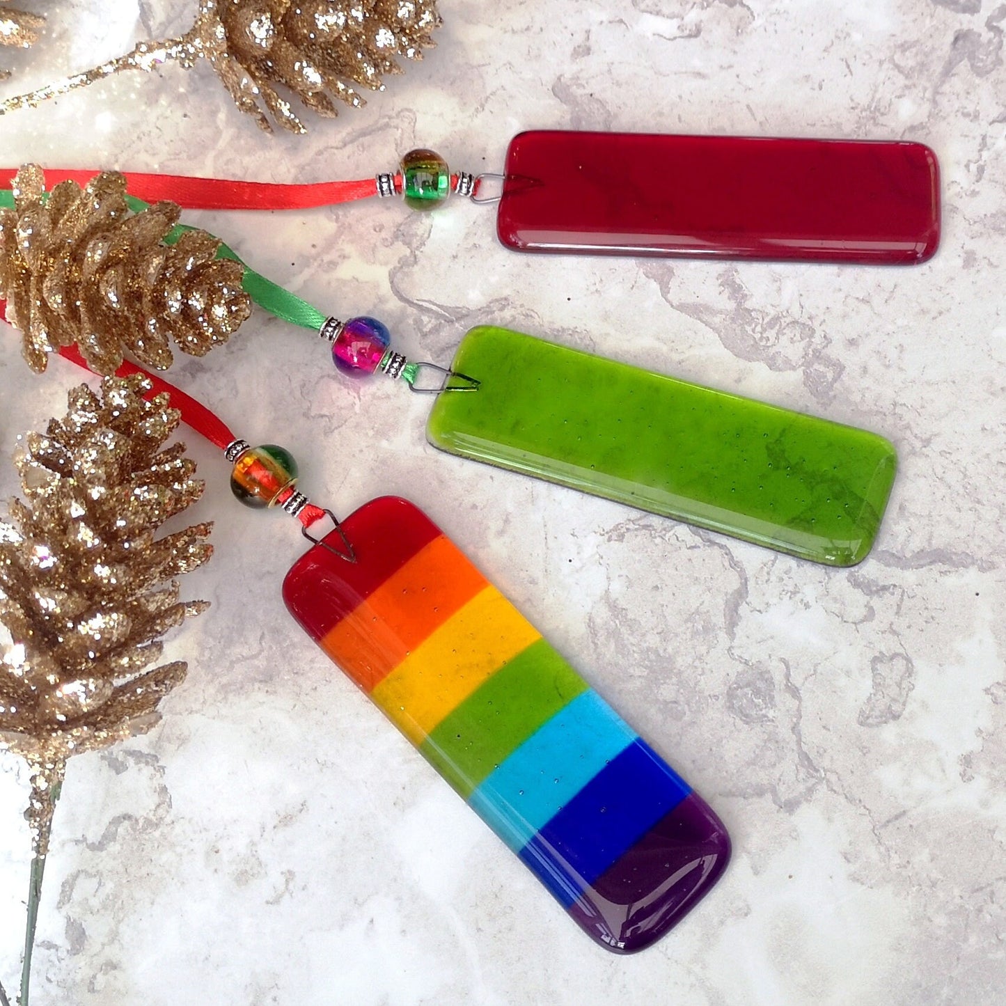 Handmade fused glass Rainbow Drops. Hanging Christmas tree decoration. Glass suncatcher bauble ornament, holiday decor gift, festive present.