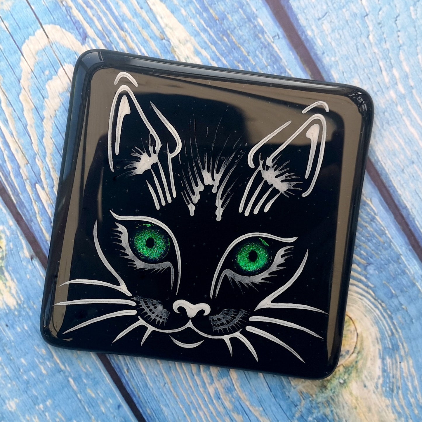 Handmade fused glass cat face drinks coaster with reflective dichroic glass eyes. Glass tile, lucky black cat. Hot drink table mat, feline decor gift. Lucky cat, crazy cat decoration, wall tile, kitten, kitty cat lover.