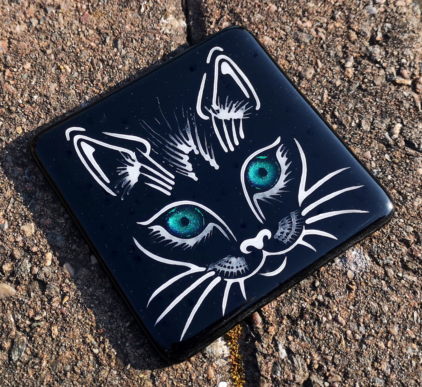 Handmade fused glass cat face drinks coaster with reflective dichroic glass eyes. Glass tile, lucky black cat. Hot drink table mat, feline decor gift. Lucky cat, crazy cat decoration, wall tile, kitten, kitty cat lover.