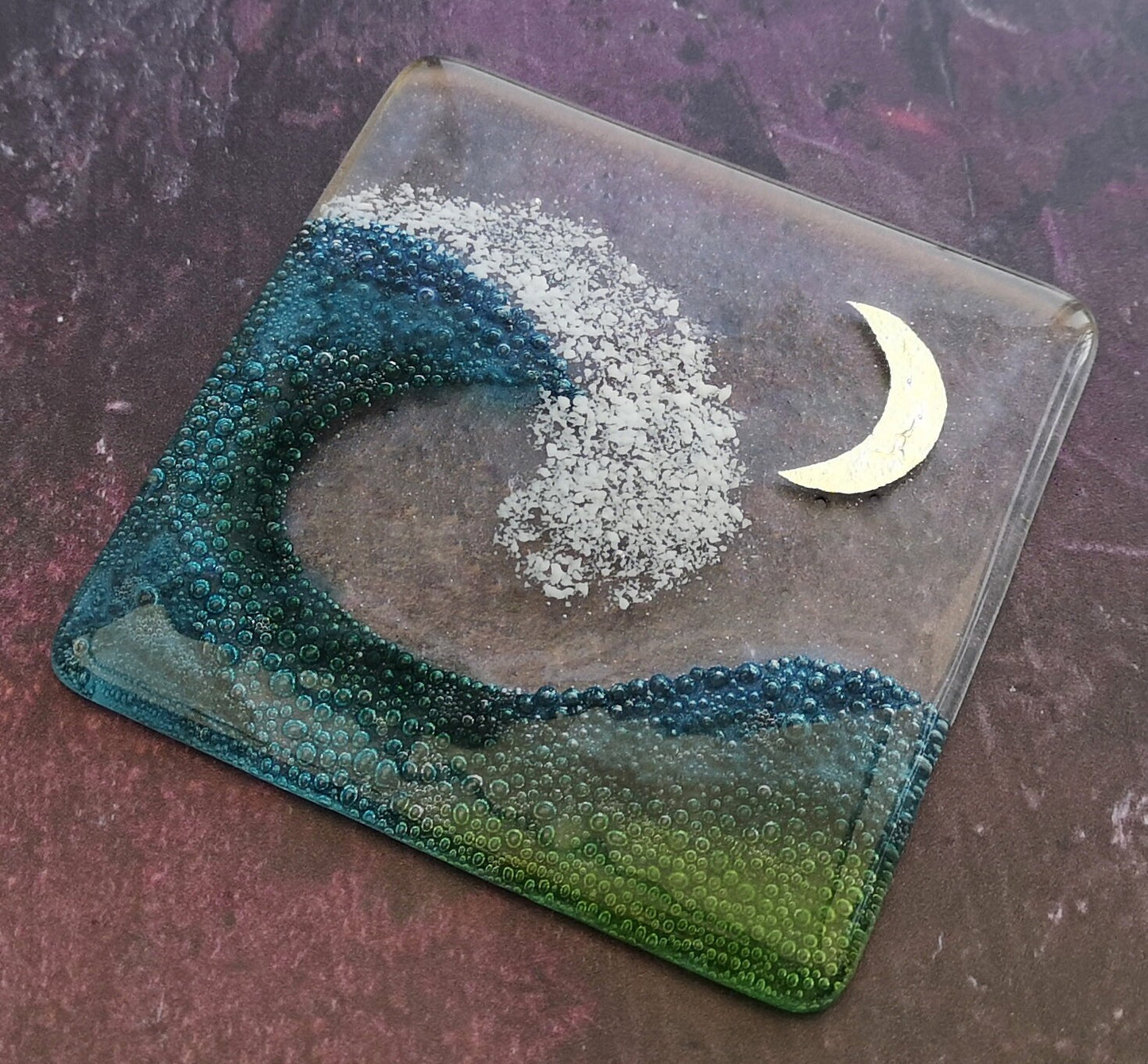 Handmade fused glass wave drinks coaster with embedded coloured bubbles and pure silver foil moon. Glass wall tile, hot drink table mat, sea, ocean home decoration, dining table protection. Beach gift.