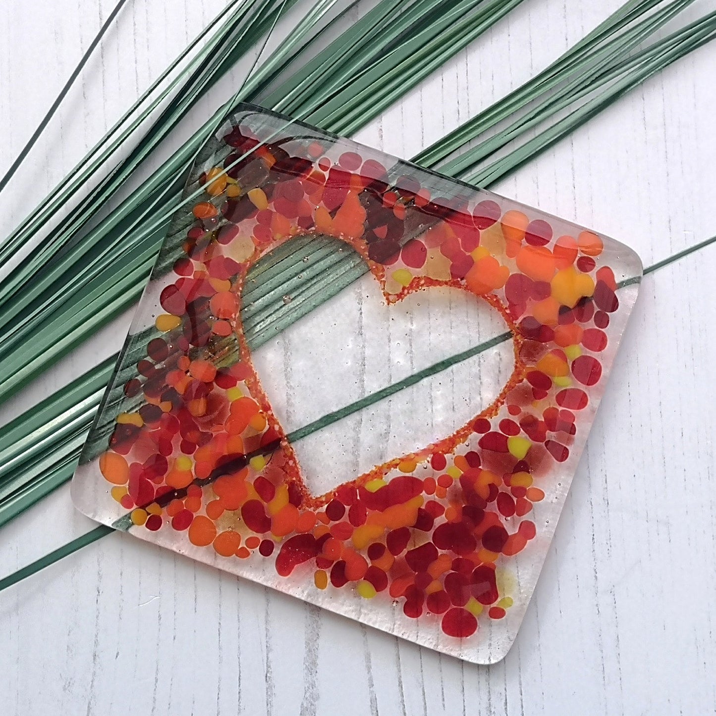 Handmade fused glass love heart drinks coaster, glass heart design wall tile. Pink, red home decoration, dining table protection. Valentine, romantic gift. Wedding present.