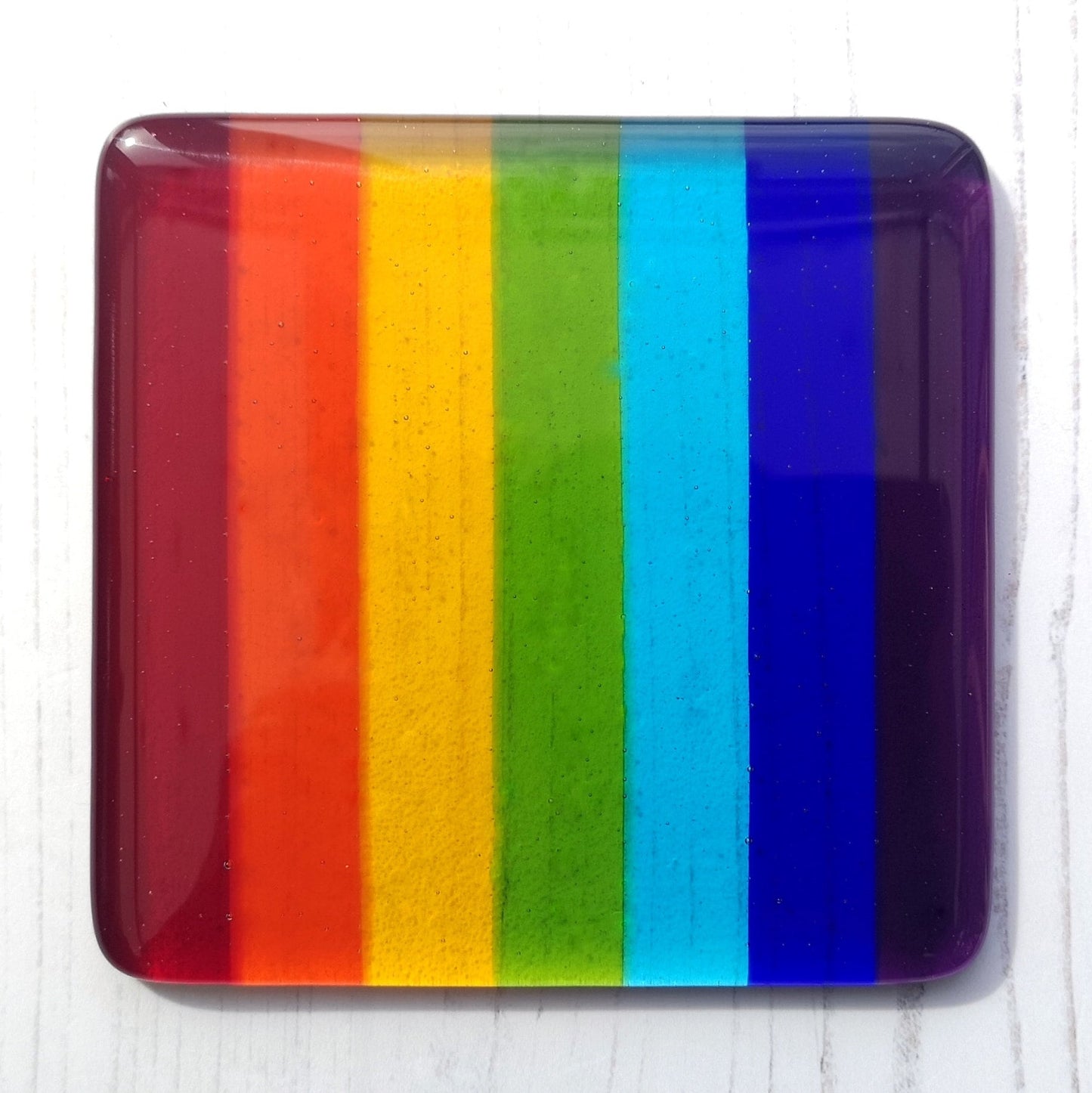 Handmade fused glass rainbow striped drinks coaster. Colourful glass wall tile. Hot drink table mat, rainbow decor, brightly coloured gift. Suncatcher multicoloured picture, home decoration, dining table protection.