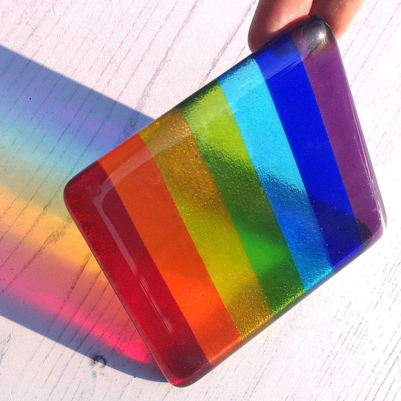 Handmade fused glass rainbow striped drinks coaster. Colourful glass wall tile. Hot drink table mat, rainbow decor, brightly coloured gift. Suncatcher multicoloured picture, home decoration, dining table protection.