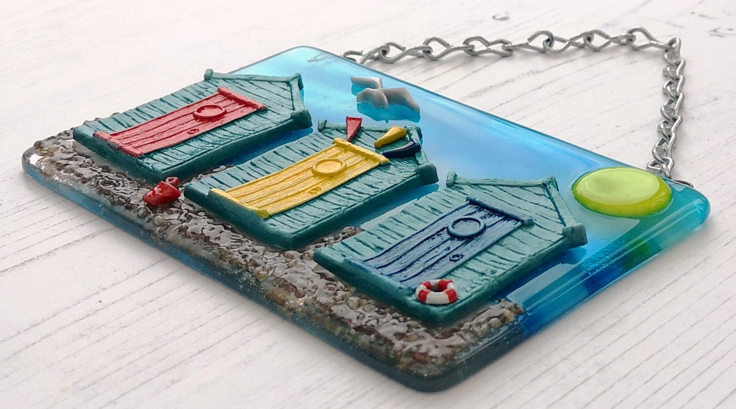 Handmade fused glass 3D Beach Huts Hanging Picture. Seaside wall art, beach gift decoration, sea ocean scene with glass pebbles, seagull, bucket and spade, bunting.