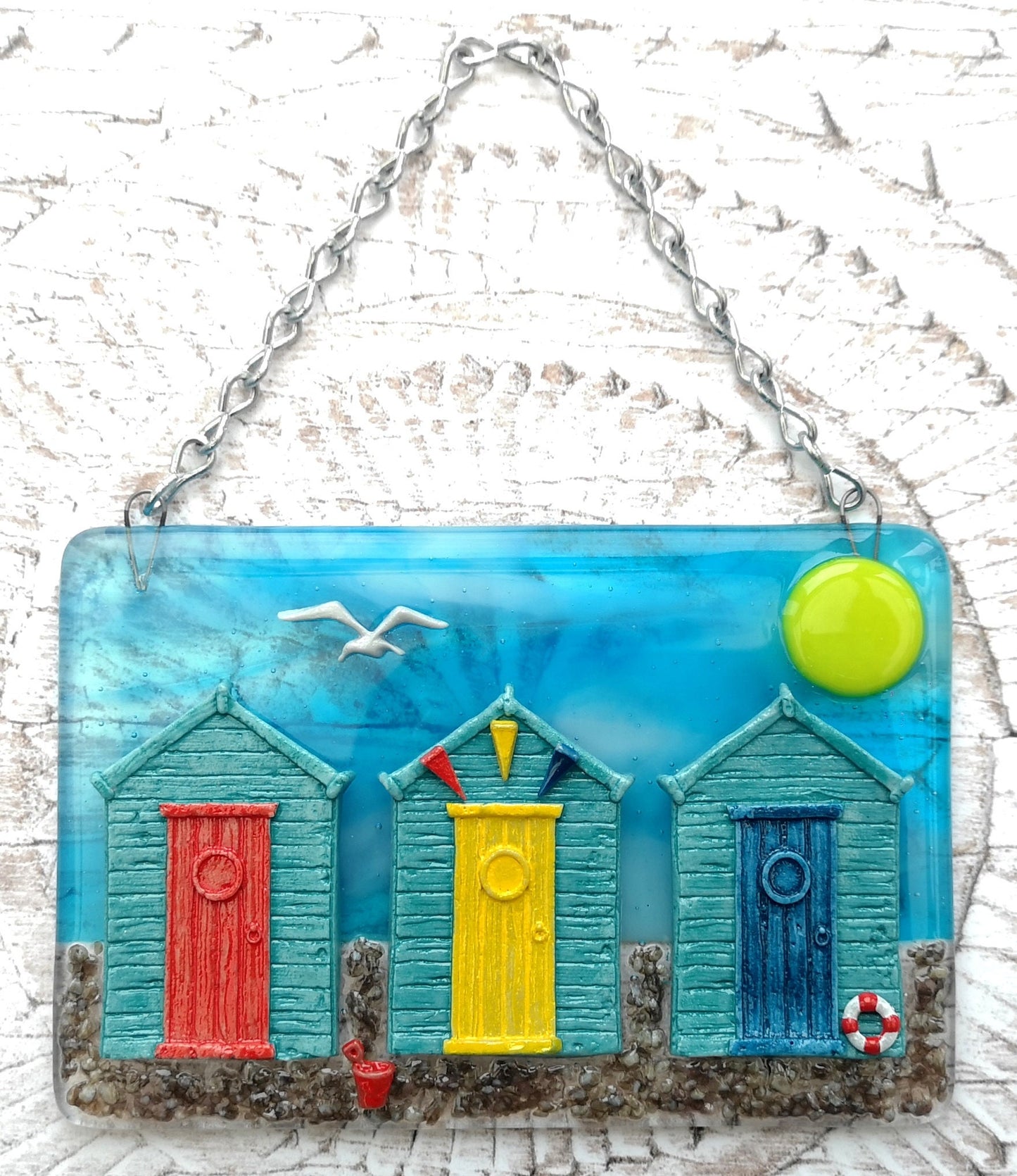 Handmade fused glass 3D Beach Huts Hanging Picture. Seaside wall art, beach gift decoration, sea ocean scene with glass pebbles, seagull, bucket and spade, bunting.
