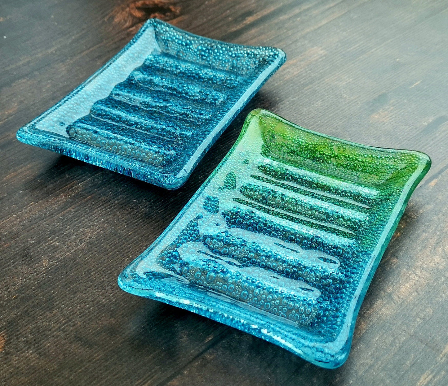 Handmade fused glass soap dish with bubbles encased inside the glass. Turquoise blue to green embedded coloured bubbles. Colourful bubbly glass soap holder. Brightly Coloured Gift.
