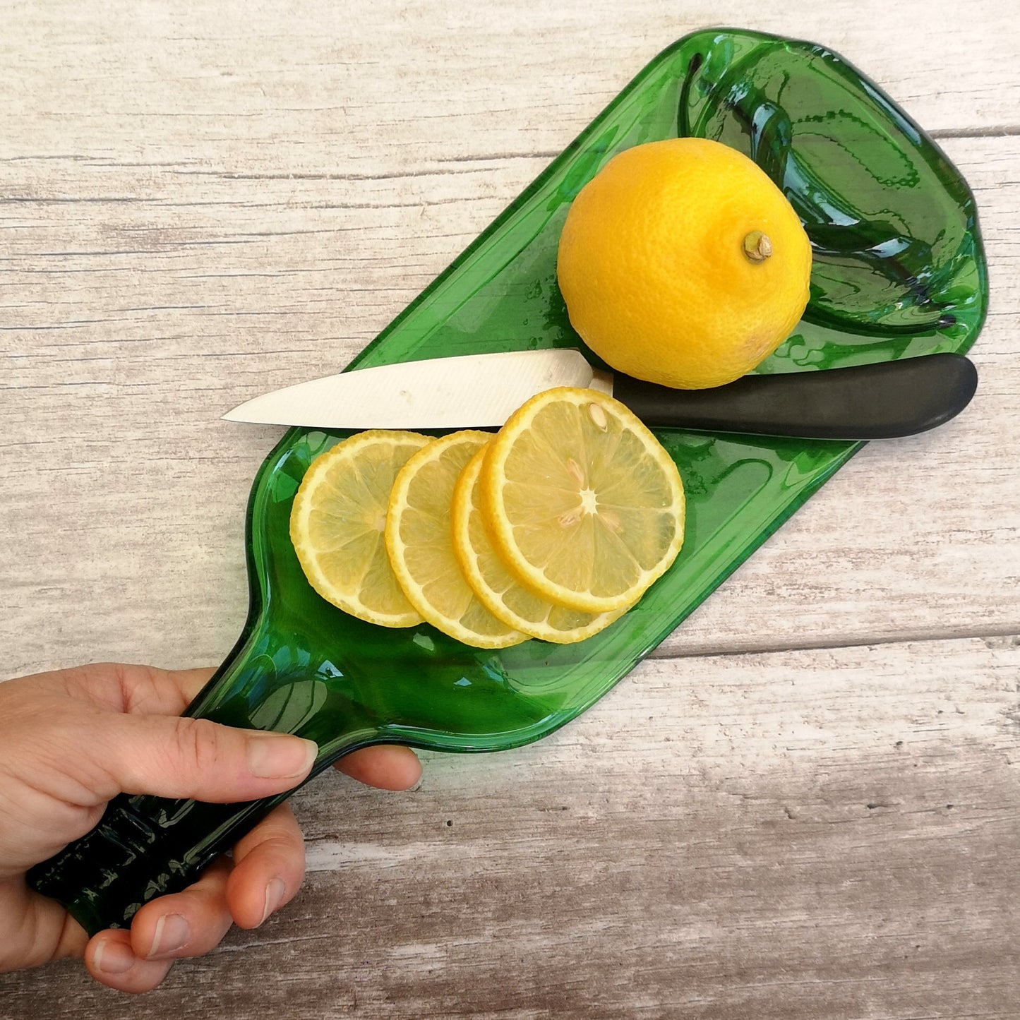 Handmade fused glass Recycled Wine Bottle Plate or Spatula With Raised Neck Handle. Squashed, slumped bottle serving dish. Eco gift, zero waste, reclaimed, upcycled glass platter.