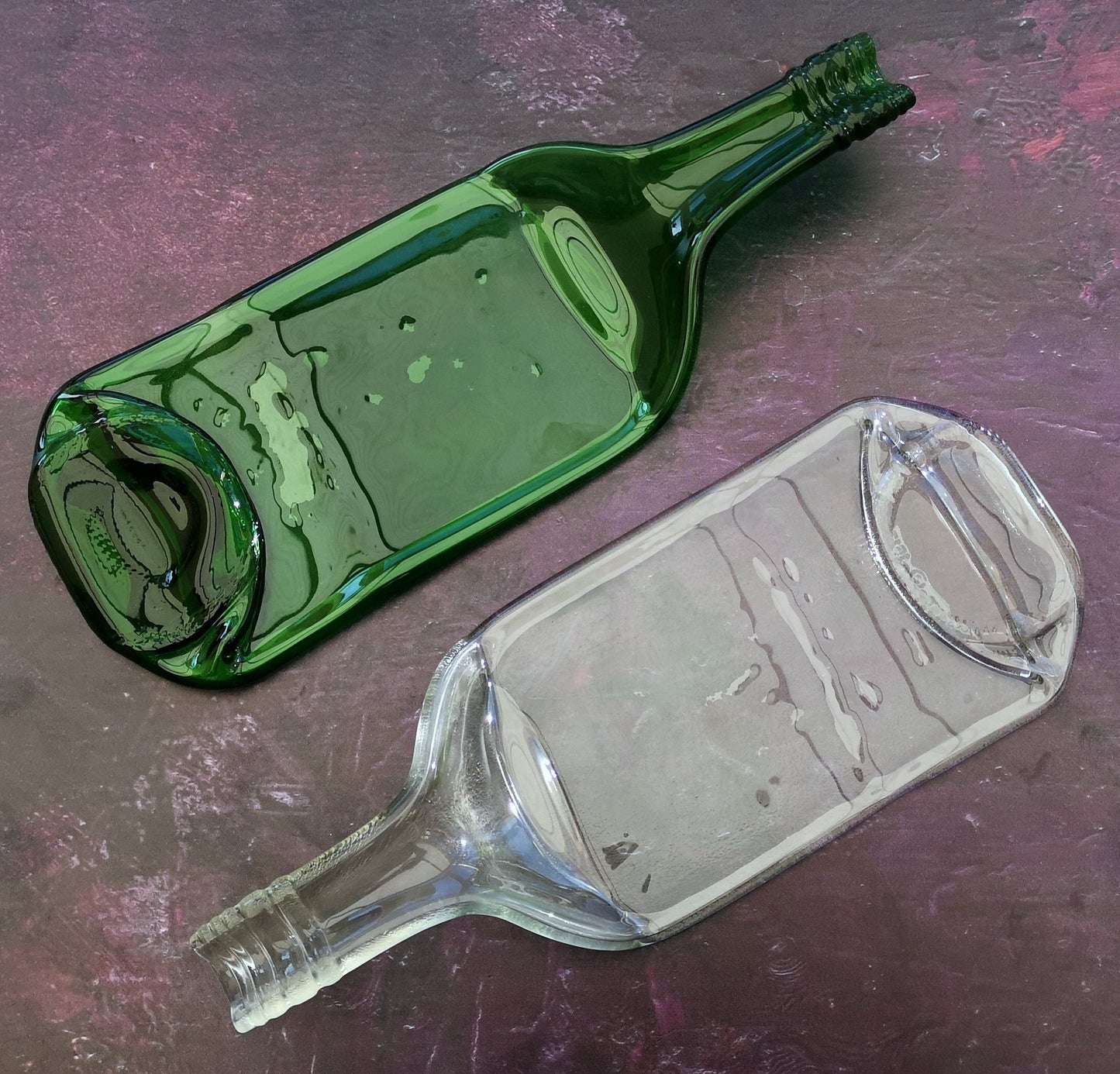 Handmade fused glass Recycled Wine Bottle Plate or Spatula With Raised Neck Handle. Squashed, slumped bottle serving dish. Eco gift, zero waste, reclaimed, upcycled glass platter.