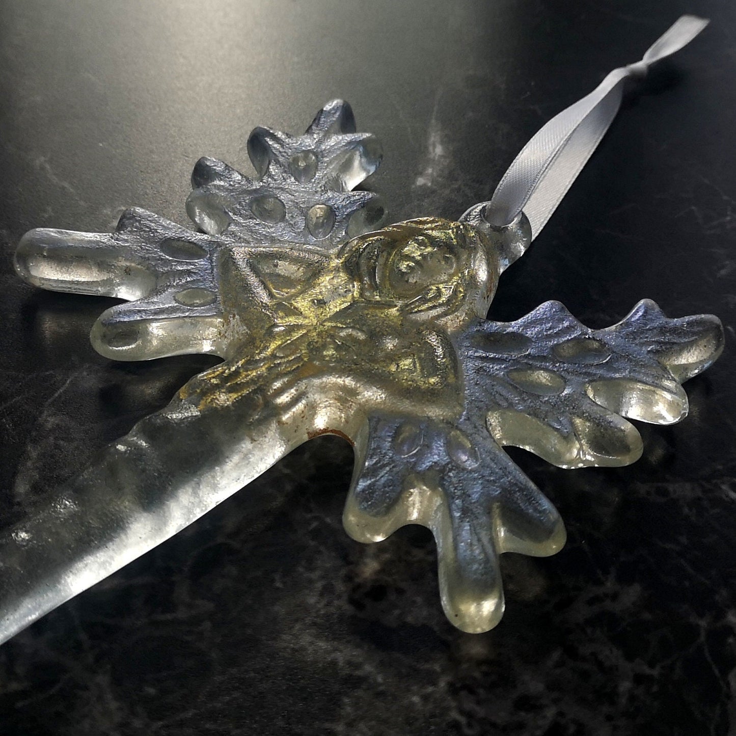 Close-up of the fairy / angel icicle hanging ornament, highlighting the delicate craftsmanship and luminous quality of the fused glass
