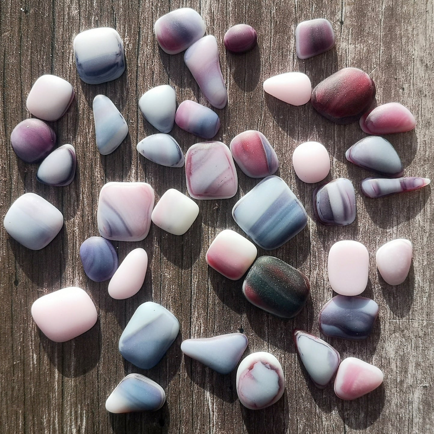 Artistic Display of Mixed Tumbled Glass in Soft Hues, Ideal for Creative Crafters