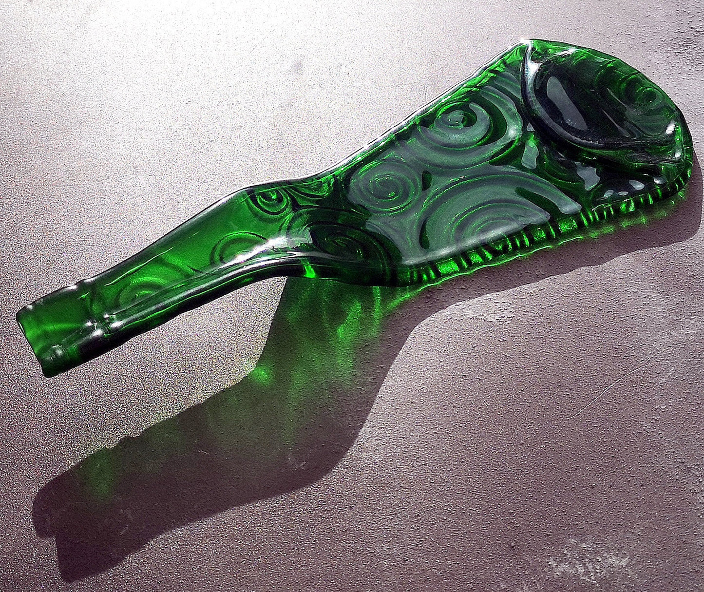 Handmade fused glass Recycled Wine Bottle Plate or Spatula Shape With Raised Neck Handle & Spiral Pattern. Squashed, slumped bottle serving dish. Eco gift, zero waste, reclaimed, upcycled glass platter.