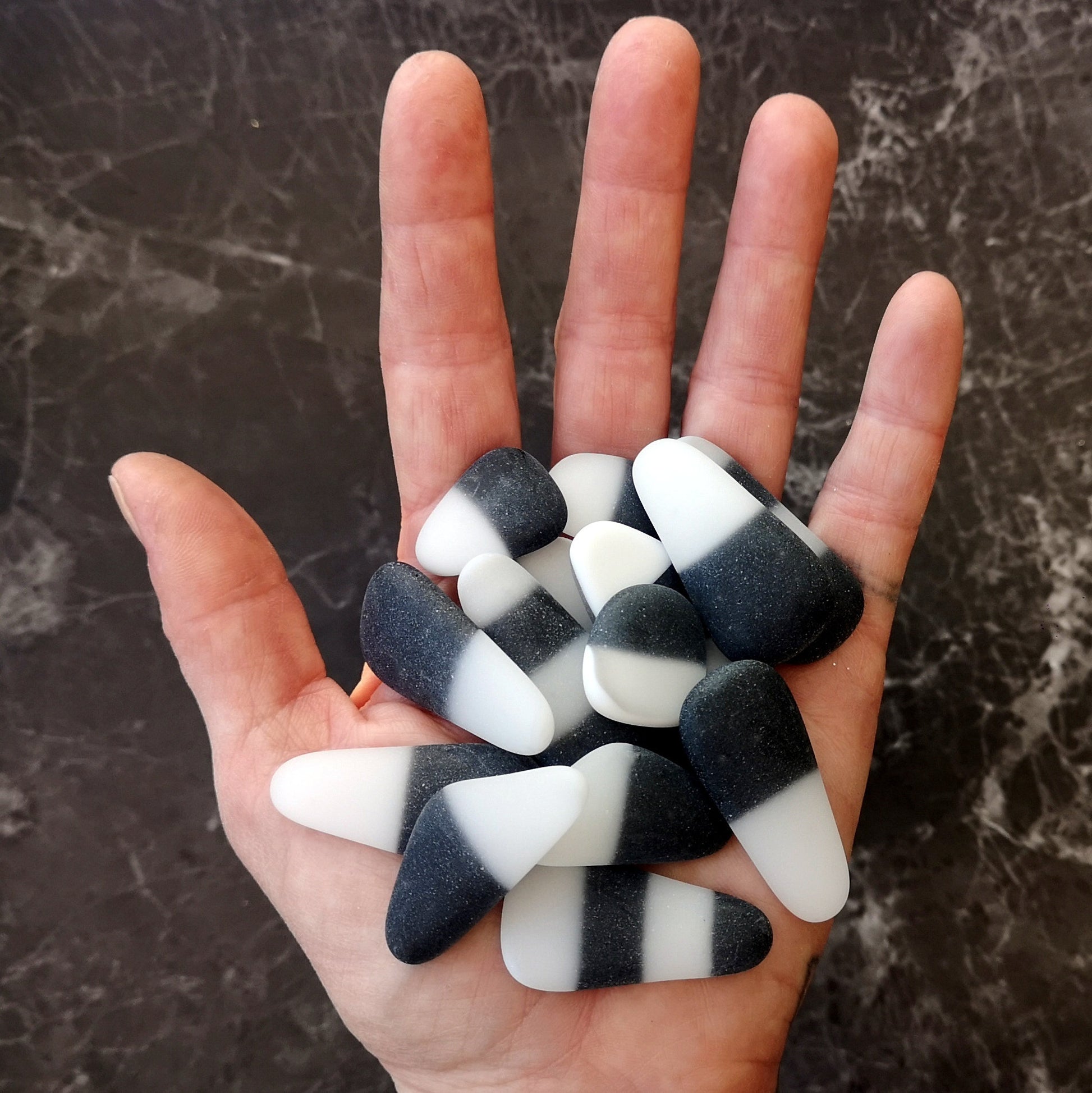 A Handful of Black and White Mixed Colour Seaglass. Dive into Creativity: Multicolored Tumbled Glass for Crafting