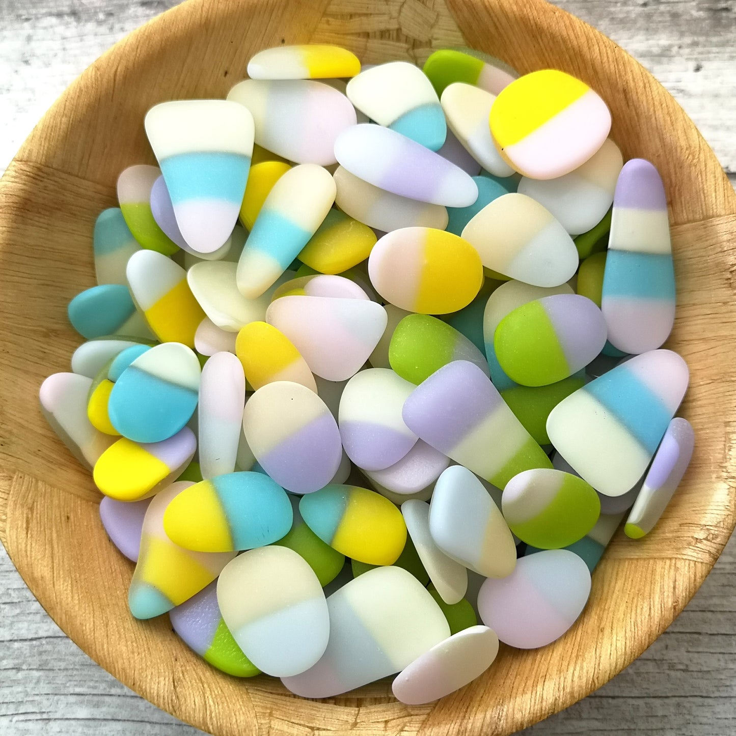 Sustainable multi coloured tumbled glass collection, environmental friendliness, recycled glass