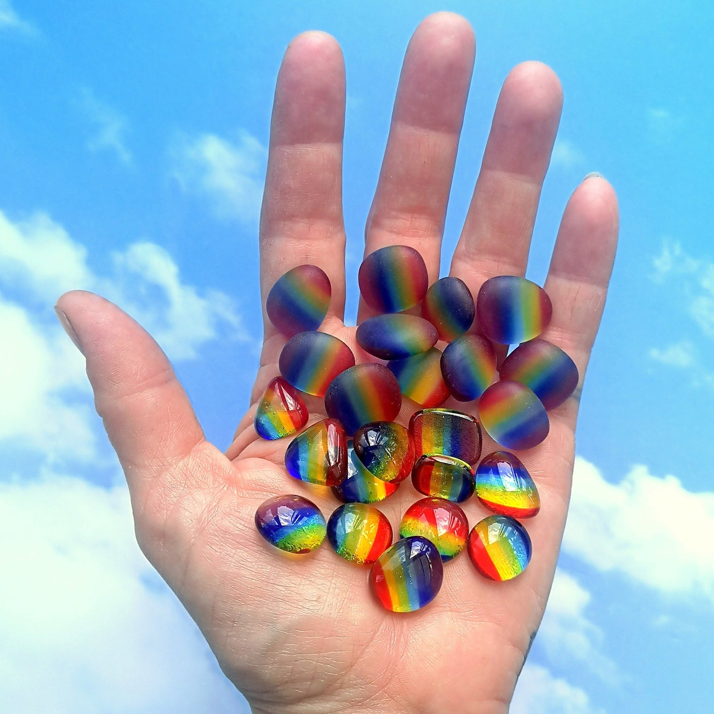 Handful of vibrant, multicoloured rainbow stripes, tumbled or polished glass pieces, capturing their distinct, weathered or shiny look, suitable for unique and personalized art creations