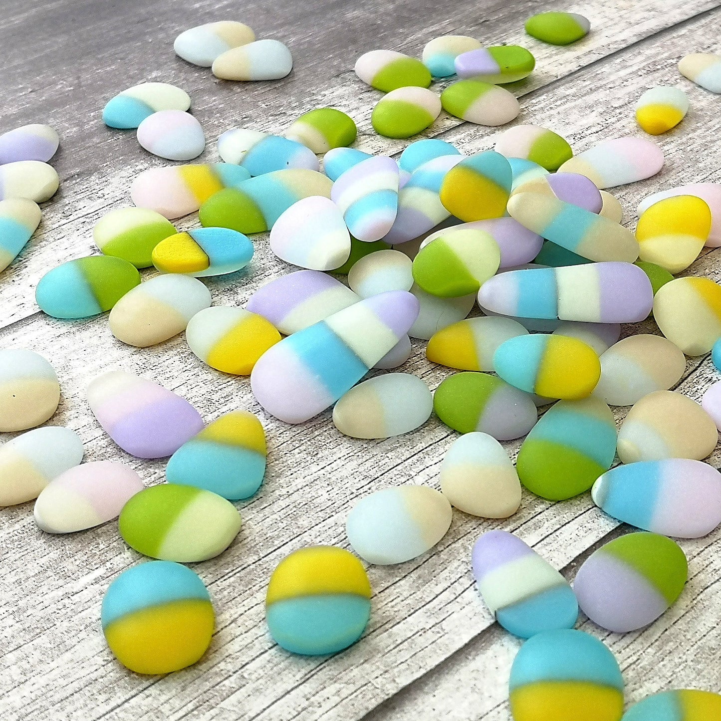 Close-up view of assorted tumbled glass in various colours, highlighting their unique frosted textures and shapes, perfect for DIY projects