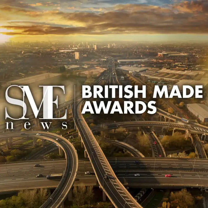 Promotional graphic for the SME News British Made Awards, featuring a golden-hour aerial view of a complex highway interchange over a cityscape, with large white text reading 'SME news BRITISH MADE AWARDS'.