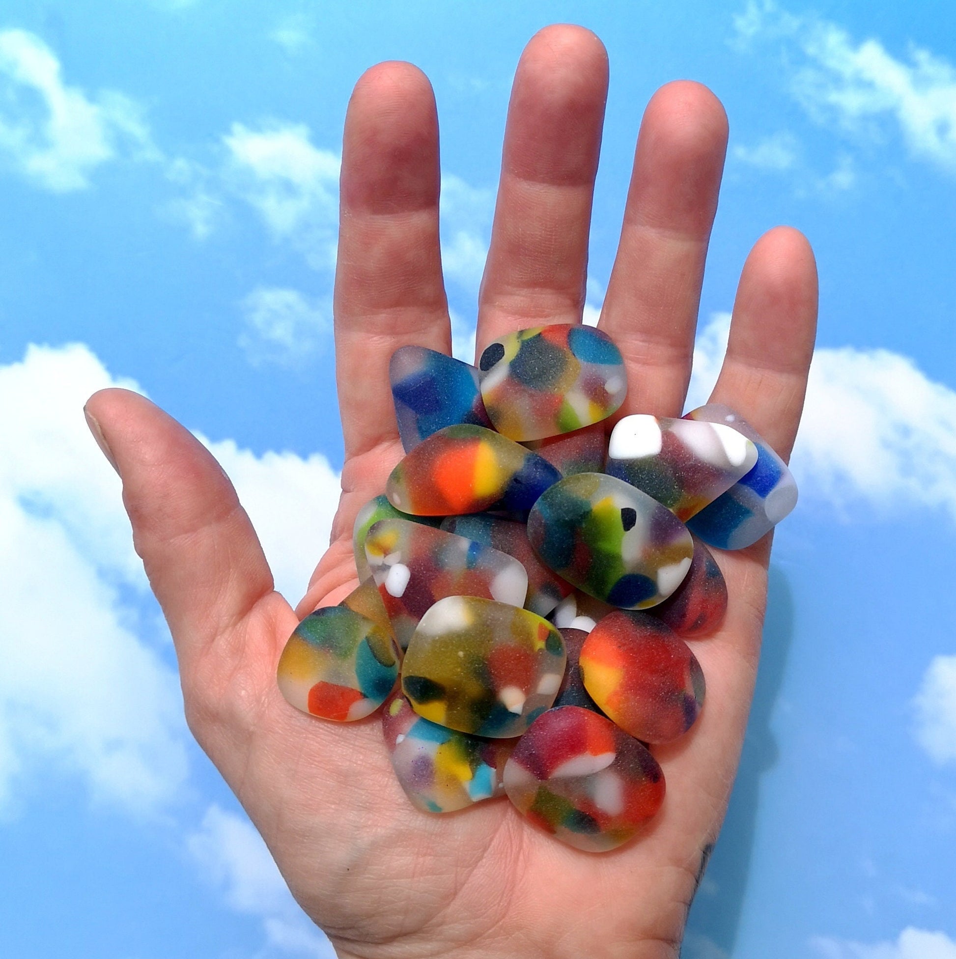 A Handful of Spotty Coloured Seaglass. Dive into Creativity: Multicoloured Tumbled Glass for Crafting